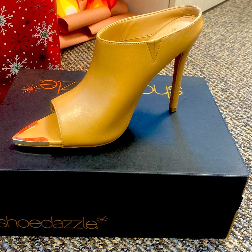 Tan open toe heels new in box.